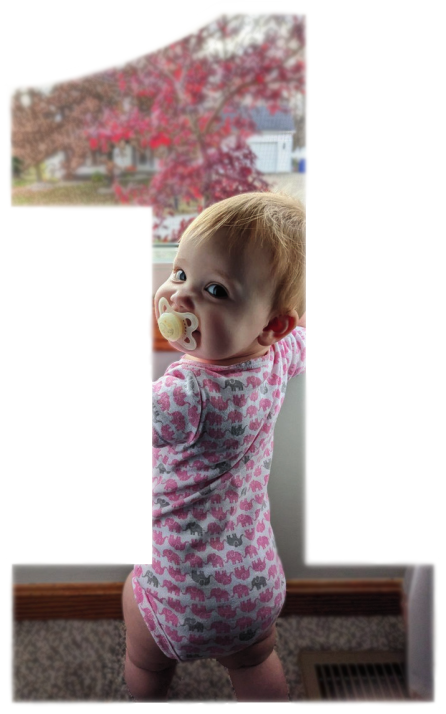 Image of Cora Boring standing at a window smiling back at the camera.